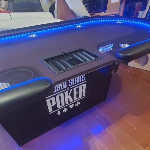 Red poker table with LED rail and tournament-style felt